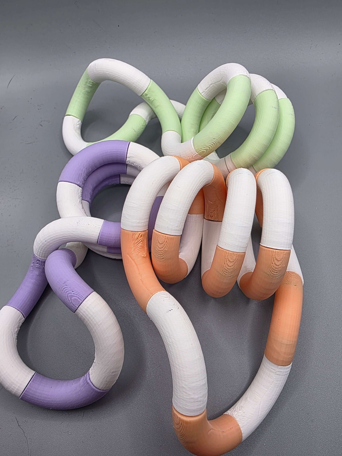 Colorful Sensit Loop by 3dFidgets, a tactile fidget for soothing movement and sensory engagement.