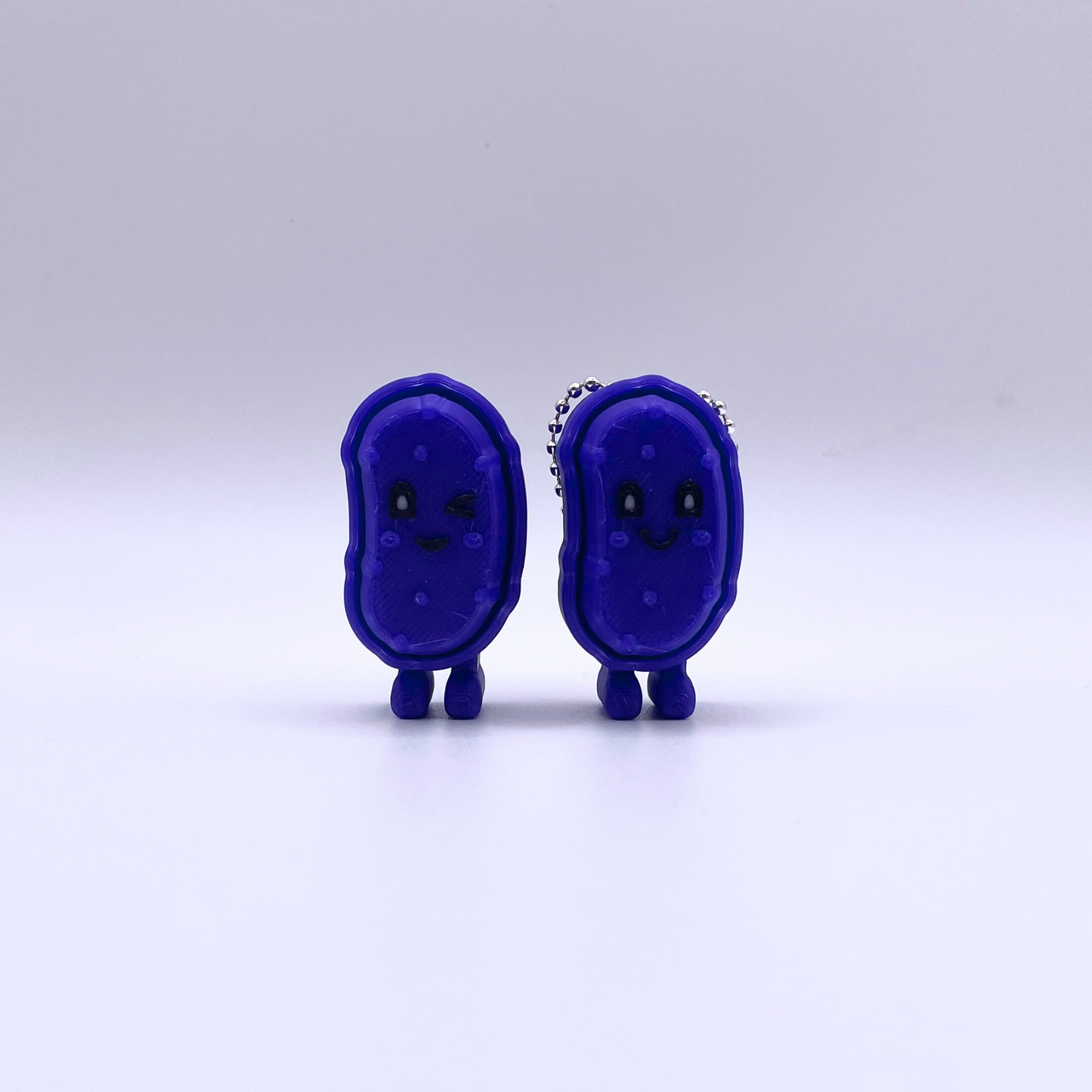 Purple Pickle color-changing textured clicker fidget toy, shifts from purple to pink with heat, perfect for ASMR and stress relief.