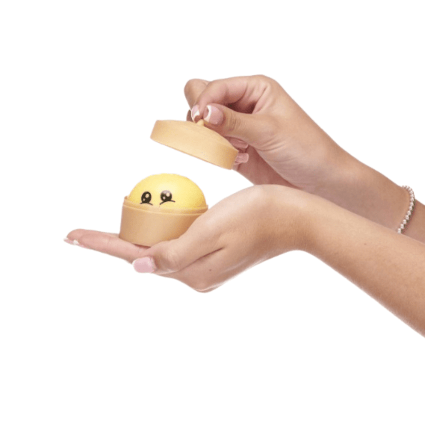 Kawaii Mini Dumplings Hand held a small yellow dumpling squishy in a plastic container
