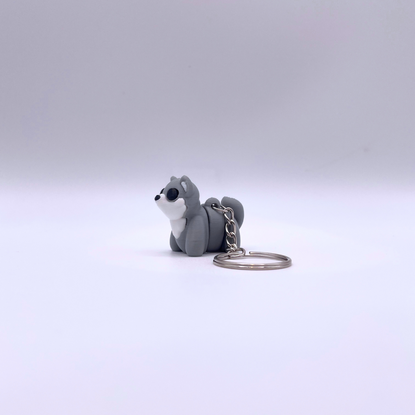 Baby Wolf Keyring articulated fidget toy in grey, white, and black, cute accessory for keys, bags, and stress relief.