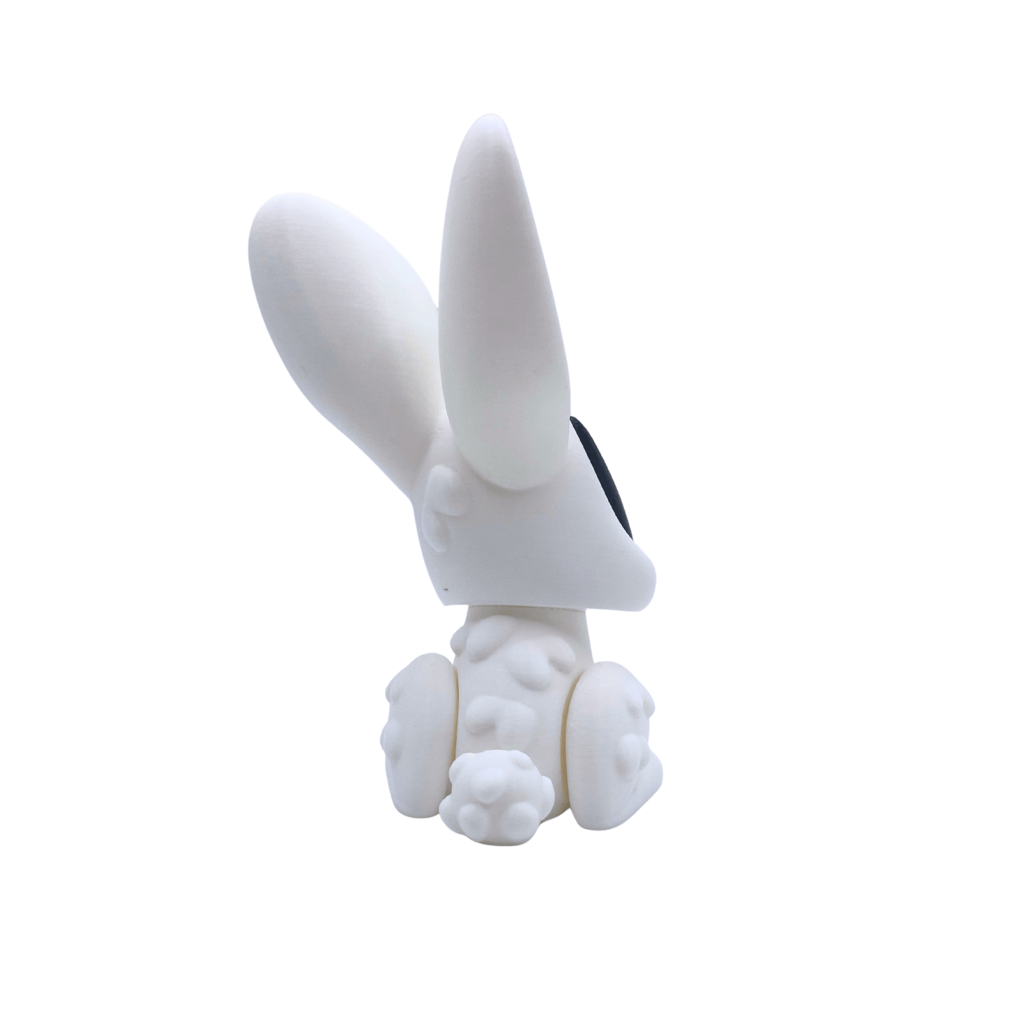 White rabbit figurine with large ears on a white background