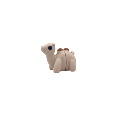 Small beige camel figurine on a white background