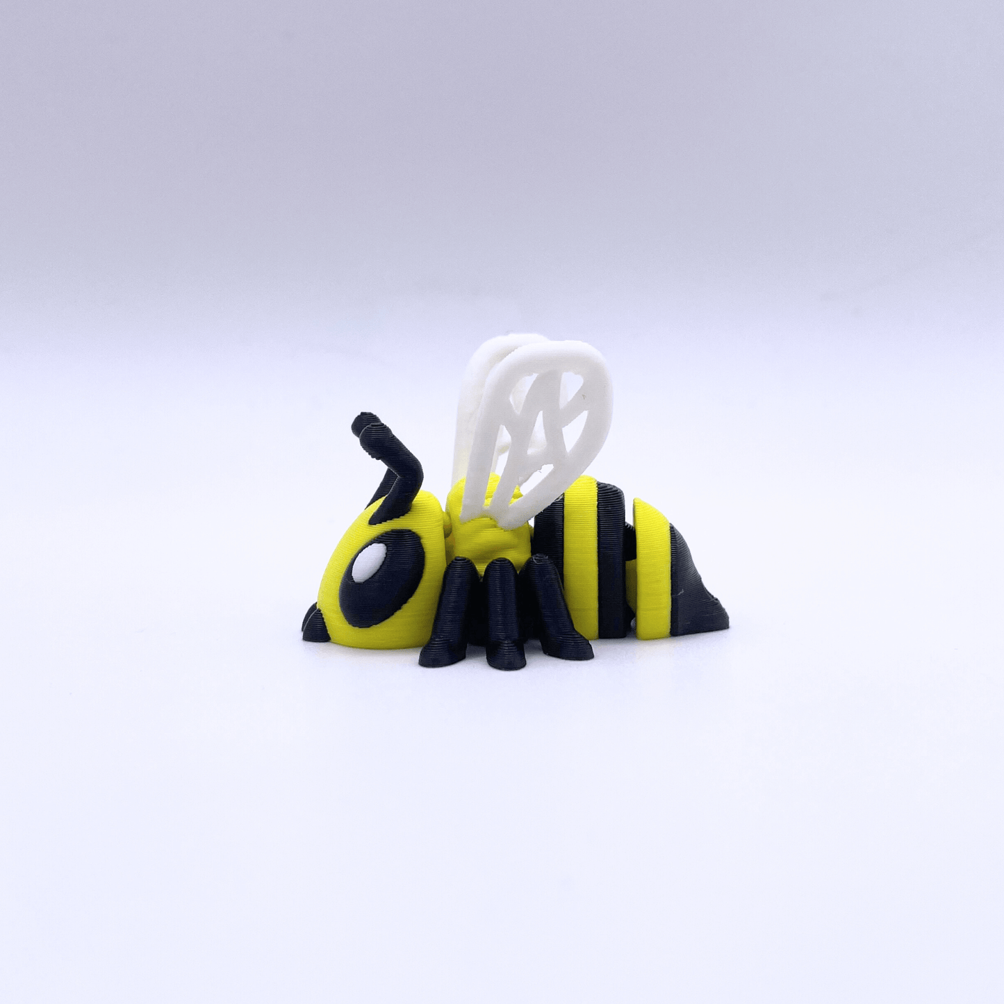 Toy bee figure on a white background