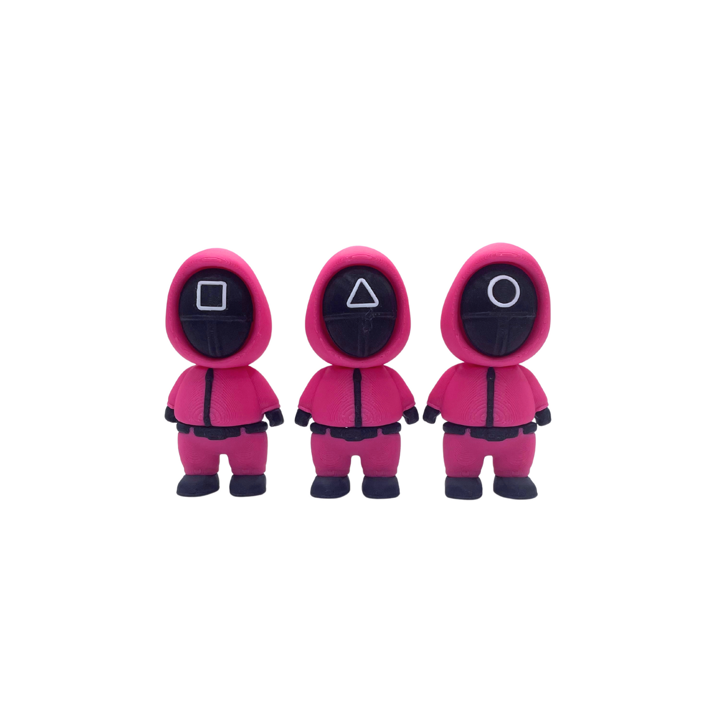 Three pink squid game guard figurines with different shapes on their masks, ideal for ASMR and fidgeting.