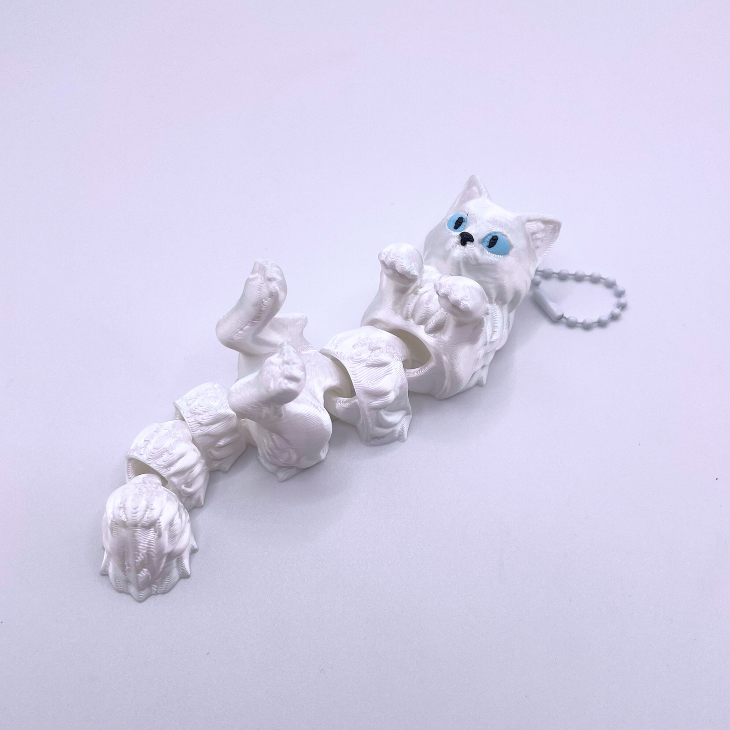 Snow Cat keyring featuring an adorable white cat design, winter-themed accessory with durable chain, perfect for keys, bags, or gifting.