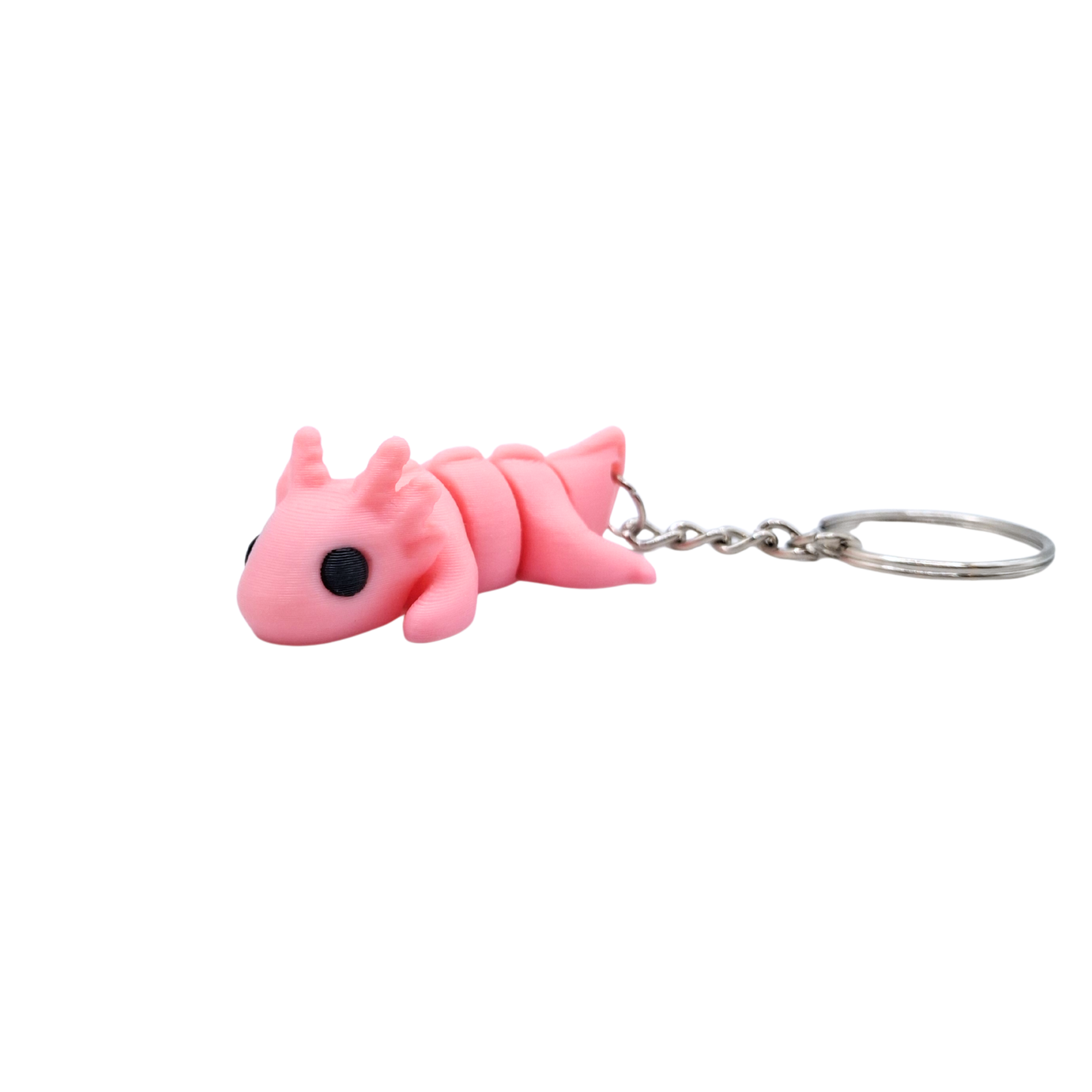 Pink axalotl cartoon-like creature keychain on a white background