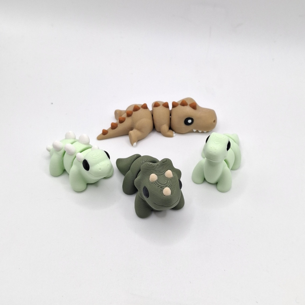 Dino pack flexi fidget toys Triceratops, stegosaurus, brontosaurus, t-rex, neutral colours