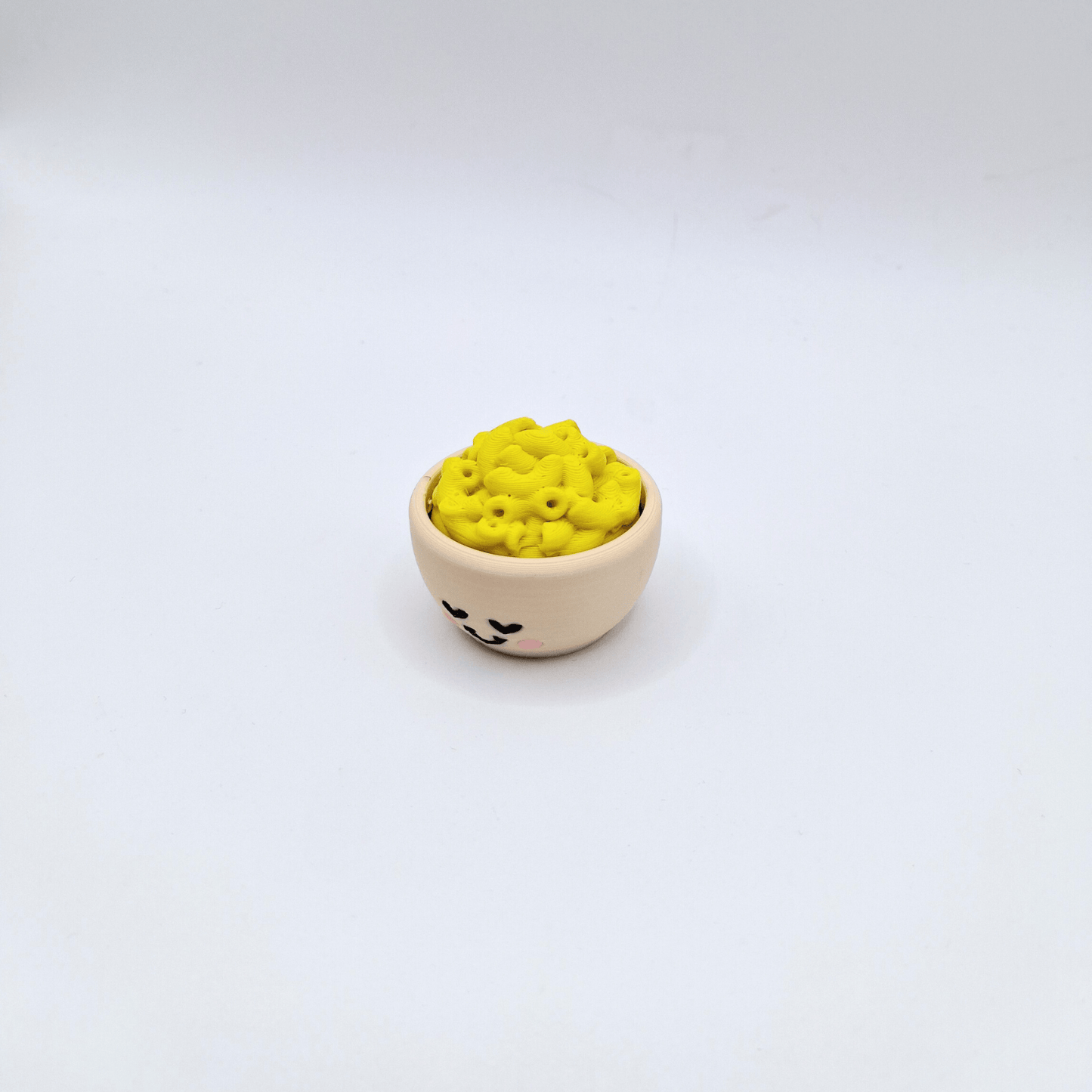 Mac n Cheese fidget toy asmr clicker with yellow top and beige bowl with face loud or quiet
