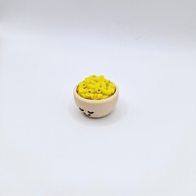 Mac n Cheese fidget toy asmr clicker with yellow top and beige bowl with face loud or quiet