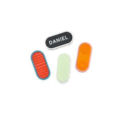 Custom Mag Slider customizable fidget buttons in various colors and textures on a neutral background.