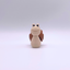 Brown and beige clicker snail fidget toy with smiling face, ideal for ASMR and sensory play.