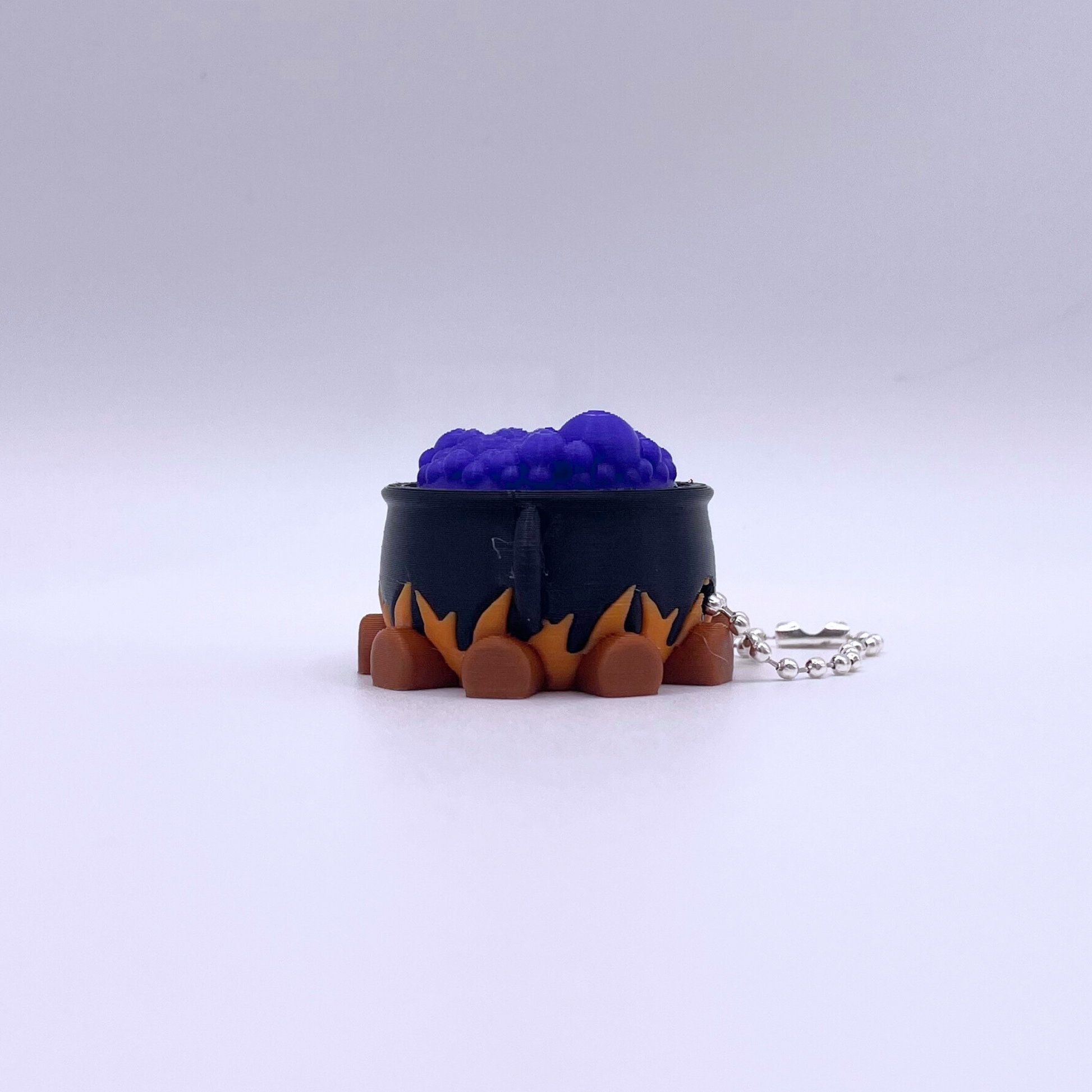 Cauldron Clicker Halloween fidget toy with crisp ASMR clicks, spooky design, and magical style—perfect seasonal gift for stress relief.
