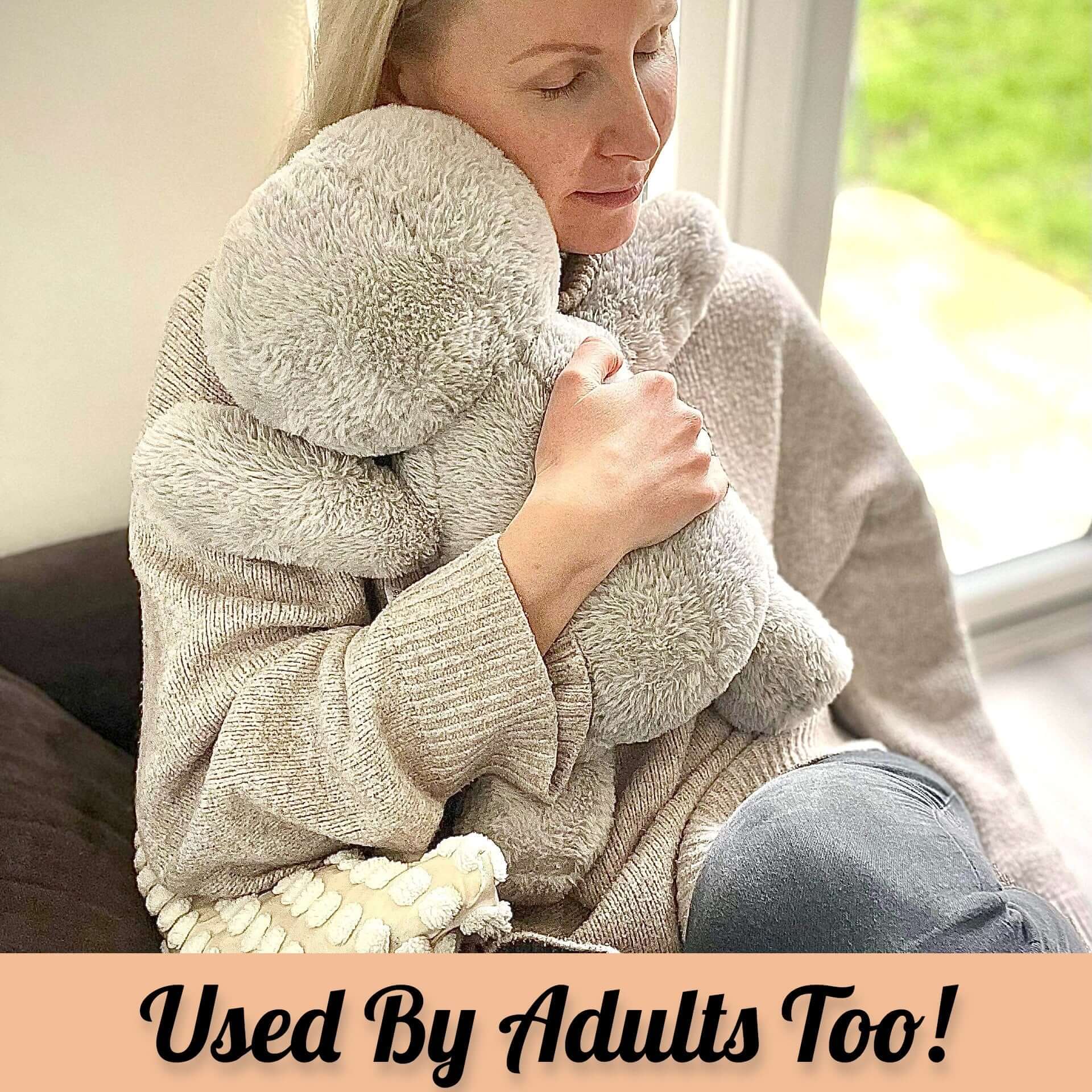 Adult using a weighted stuffed animal for anxiety, highlighting its calming benefits and comfort.
