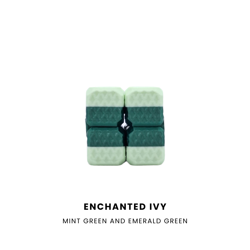 A 2x2 puzzle cube in mint green and emerald green with a black center crossbar, shown on a white background with the text 'ENCHANTED IVY' and 'MINT GREEN AND EMERALD GREEN' below.