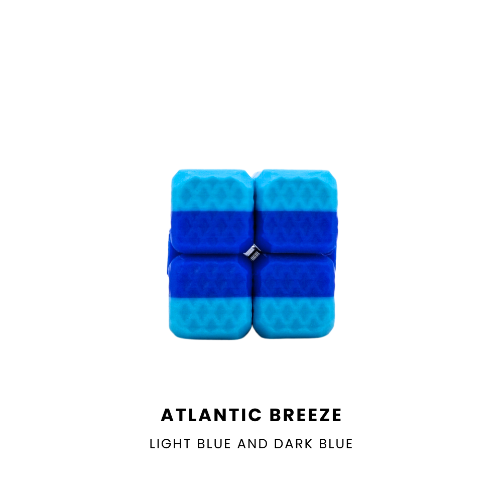 A 4x4 puzzle block in a colour combination of light blue and dark blue, with the text 'ATLANTIC BREEZE LIGHT BLUE AND DARK BLUE' printed below on a solid white background.