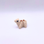 Small beige camel figurine on a white background
