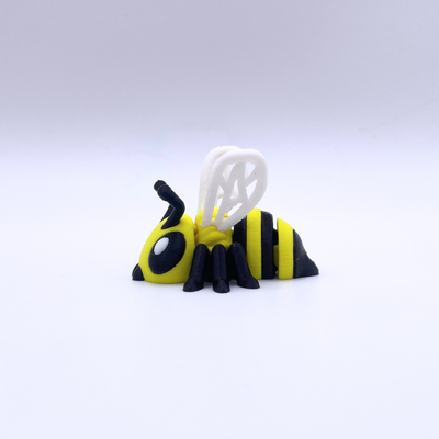 Toy bee figure on a white background