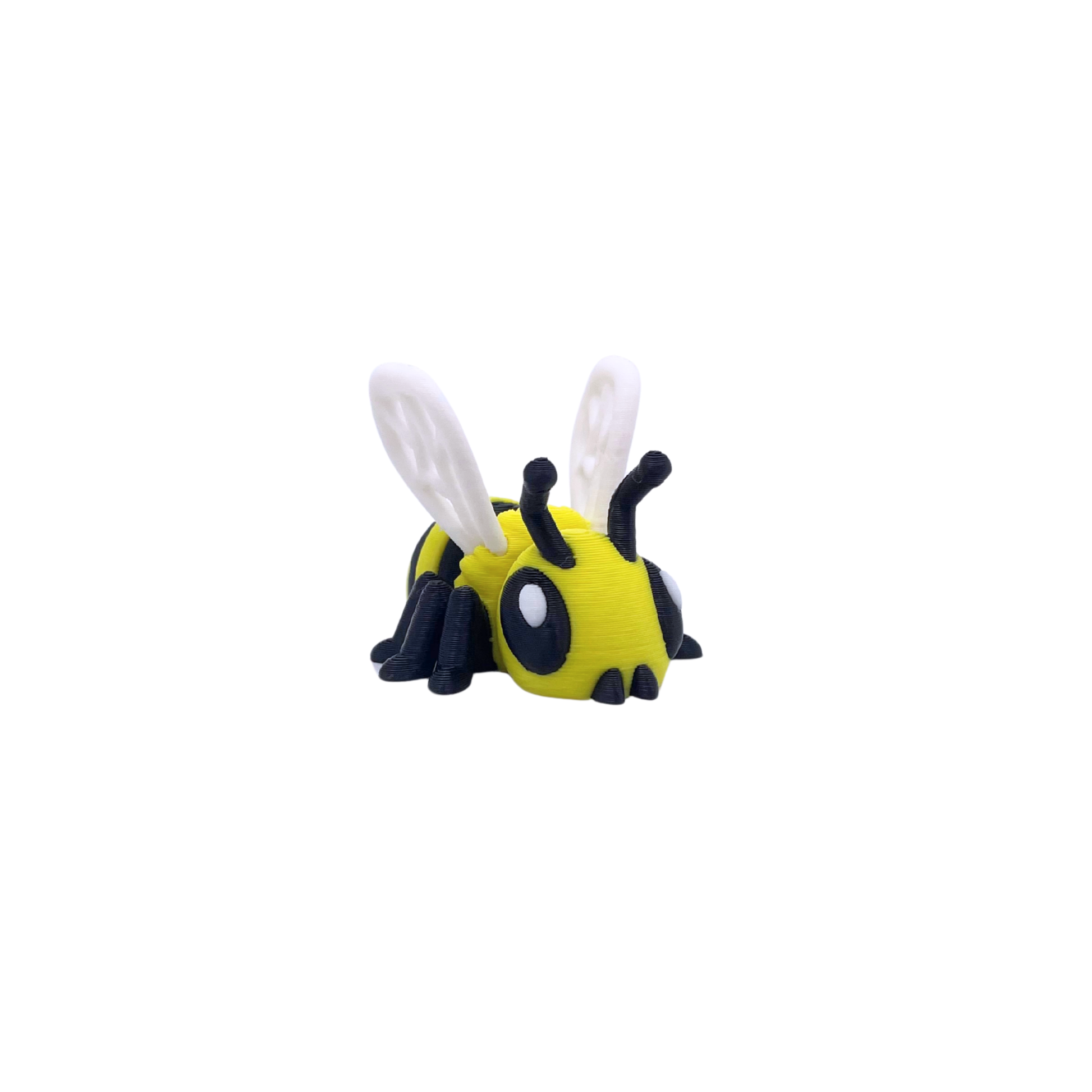 Toy bee keyring with black and yellow body on a white background