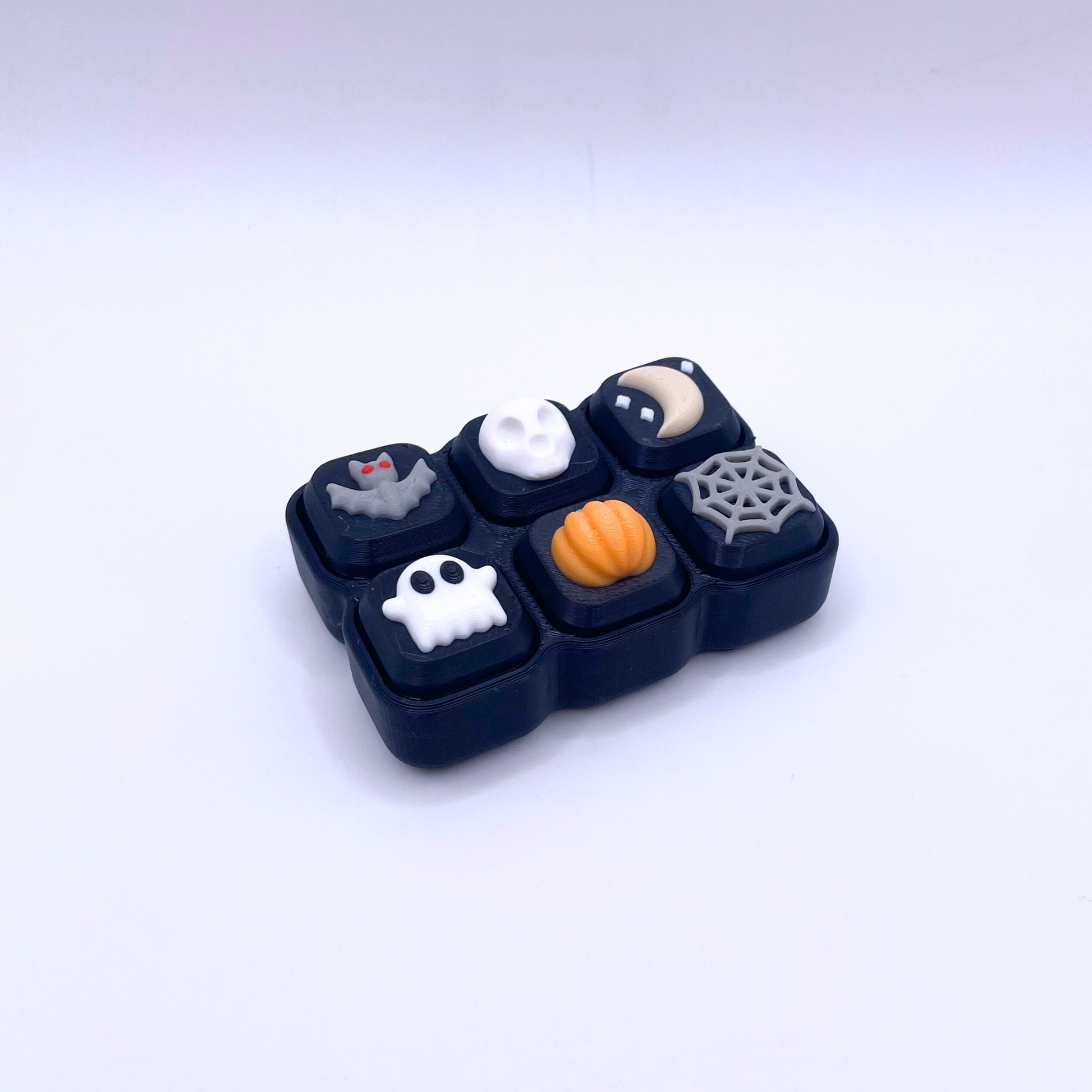 Halloween Clicker Pad with 6 spooky buttons, crisp ASMR clicks, and festive design – limited edition Halloween fidget toy.