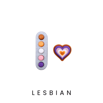 Two colorful earrings on a white background with the word 'LESBIAN' below them.