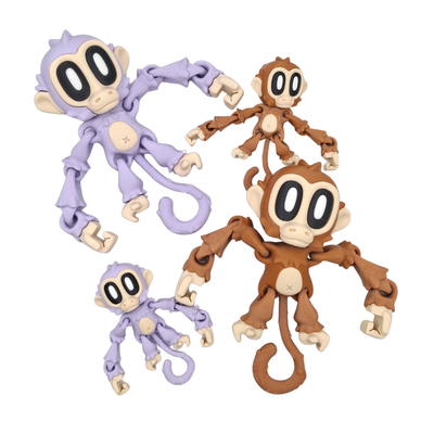 Four monkey-themed toys in purple and brown on a white background