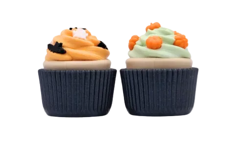 Two Halloween-themed cupcake-shaped erasers on a plain white background. The left cupcake has orange frosting with a black bat detail, and the right cupcake has mint green frosting with orange pom-pom decorations.