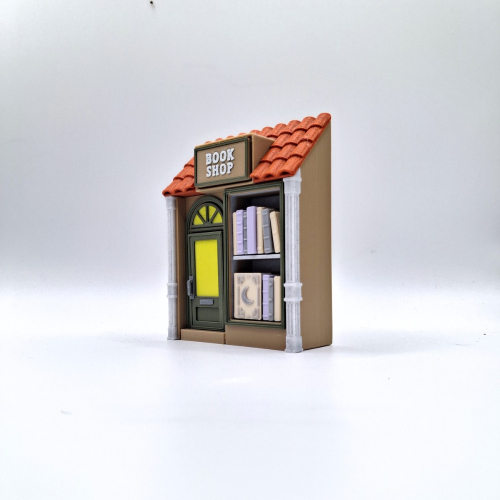 Model of a bookshop with books on a white background