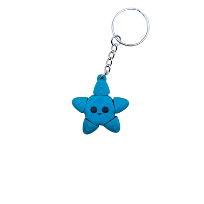 green starfish keychain with a smiley face on a white background