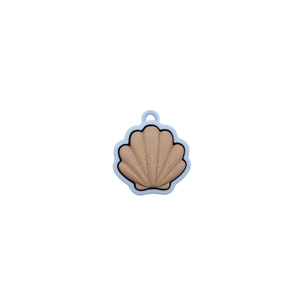 Shell Clicker in pastel colors, featuring a soft tone and quiet click, perfect for soothing sensory play.