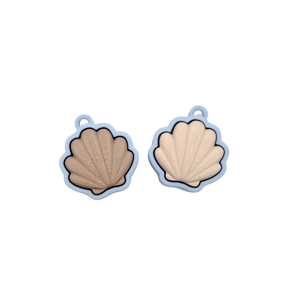 Shell Clicker in pastel colors featuring a quiet click, showcasing two soft-tone shell designs.