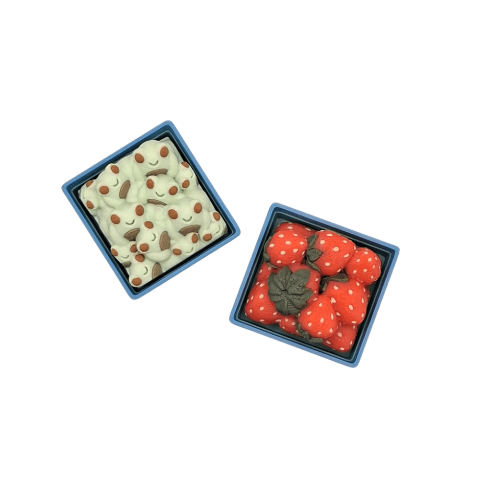 basket of frogs and strawberry clicker sensory fidget toy