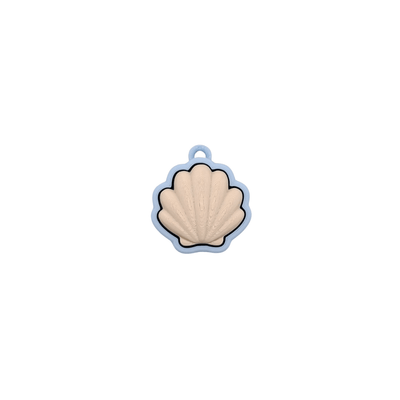 Shell Clicker in pastel blue and beige colors with a soft shell design and quiet click feature.